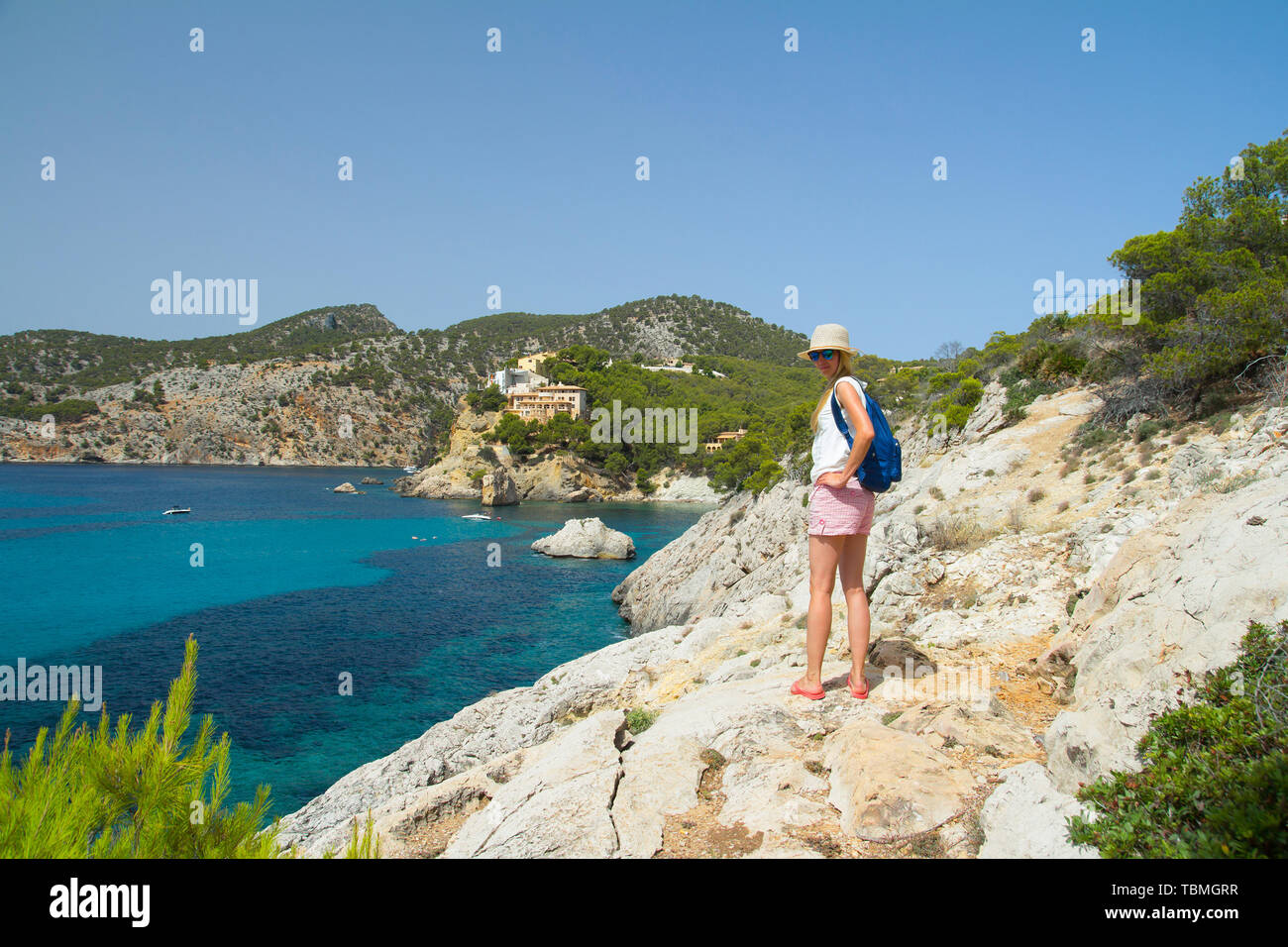 young woman tourist walking near see on summer vacation Stock Photo