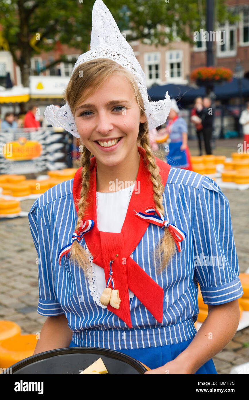 Pretty smiling girl in traditional Dutch costume, Gouda cheese market, South Holland, Netherlands, Europe Stock Photo