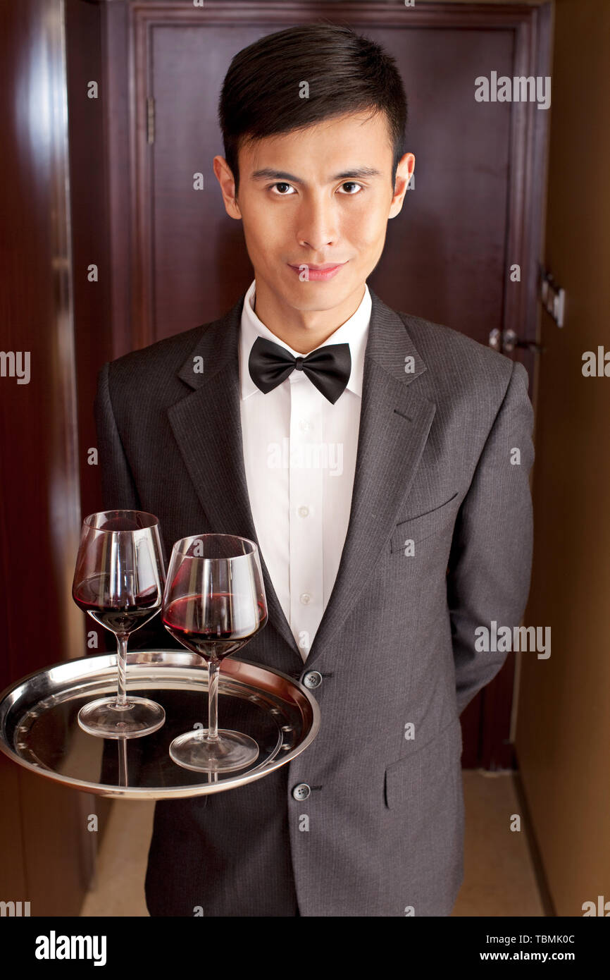 A waiter is serving at the hotel Stock Photo Alamy