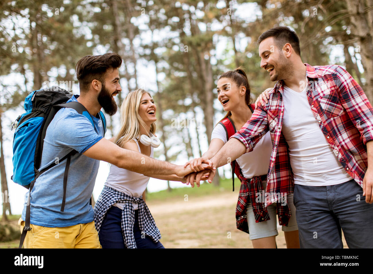 Group of young people hiking in mountain at spring day Stock Photo - Alamy