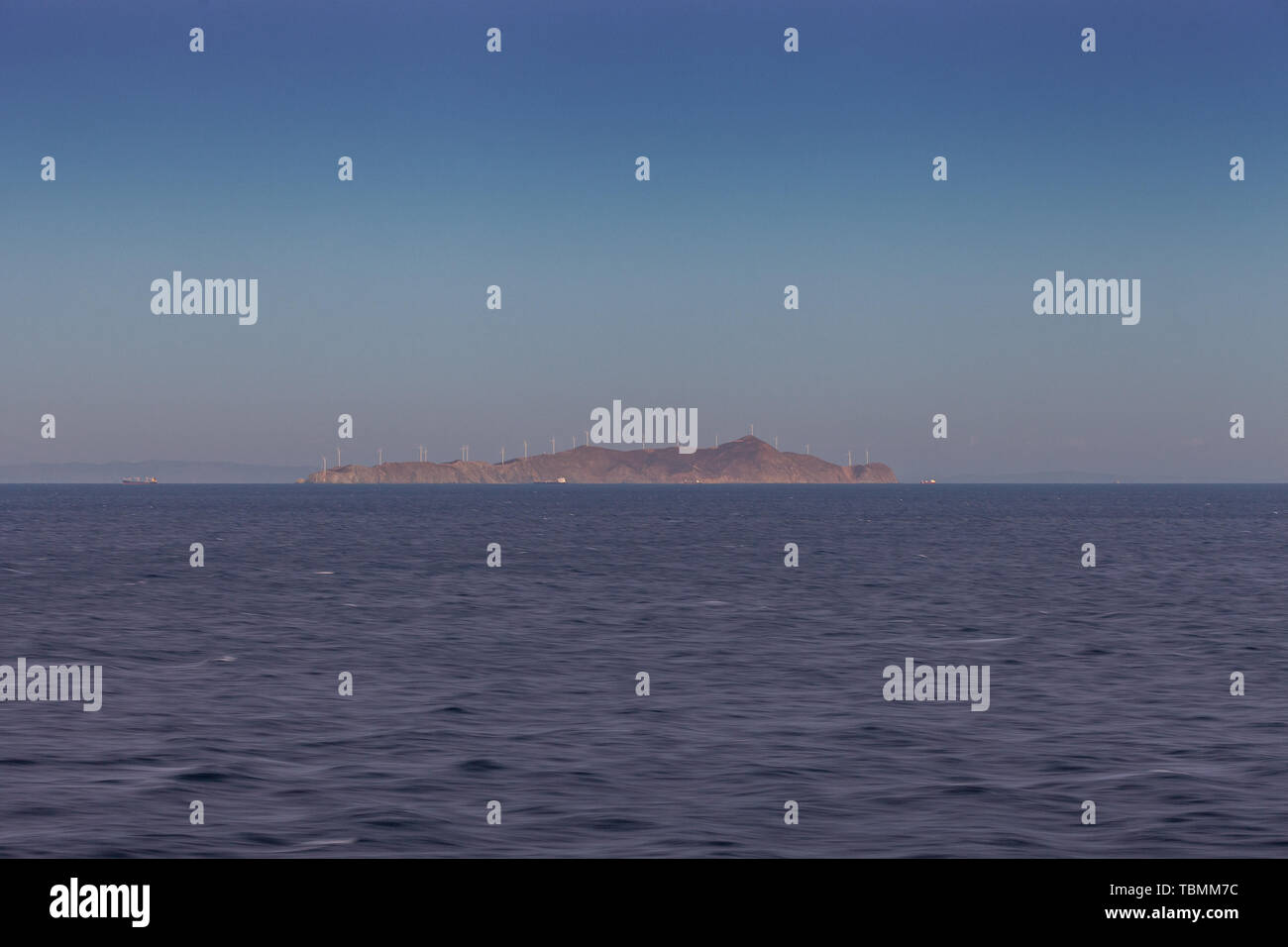 Saronic Gulf island panorama with wind turbines at sunrise Stock Photo