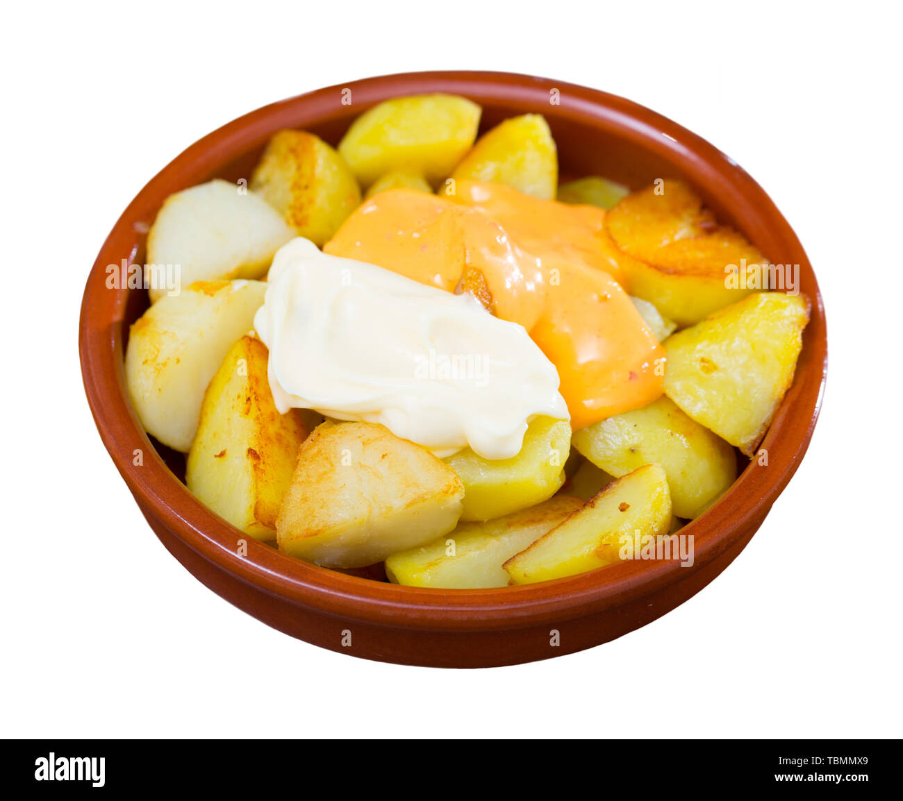 Delicious Patatas Bravas traditional Spanish potato snack. Isolated