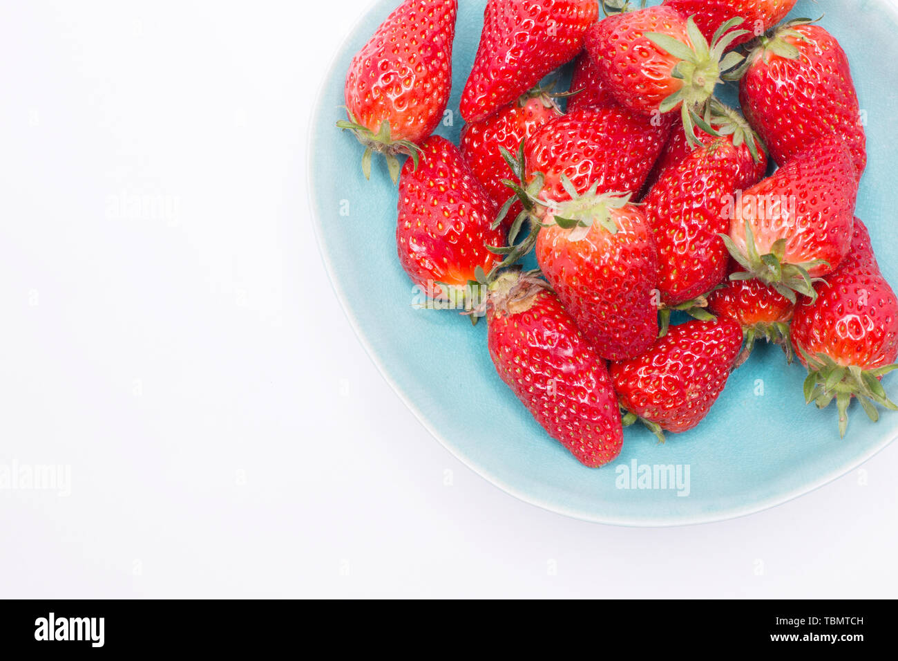 Fresh strawberries in bowl isolated on white background Stock Photo - Alamy
