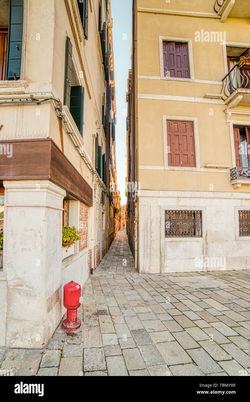 ancient buildings on typical narrow street in Venice Stock Photo Alamy