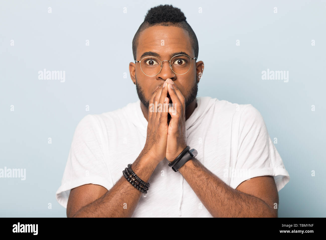 Calm black man relax with eyes closed hands over head Stock Photo