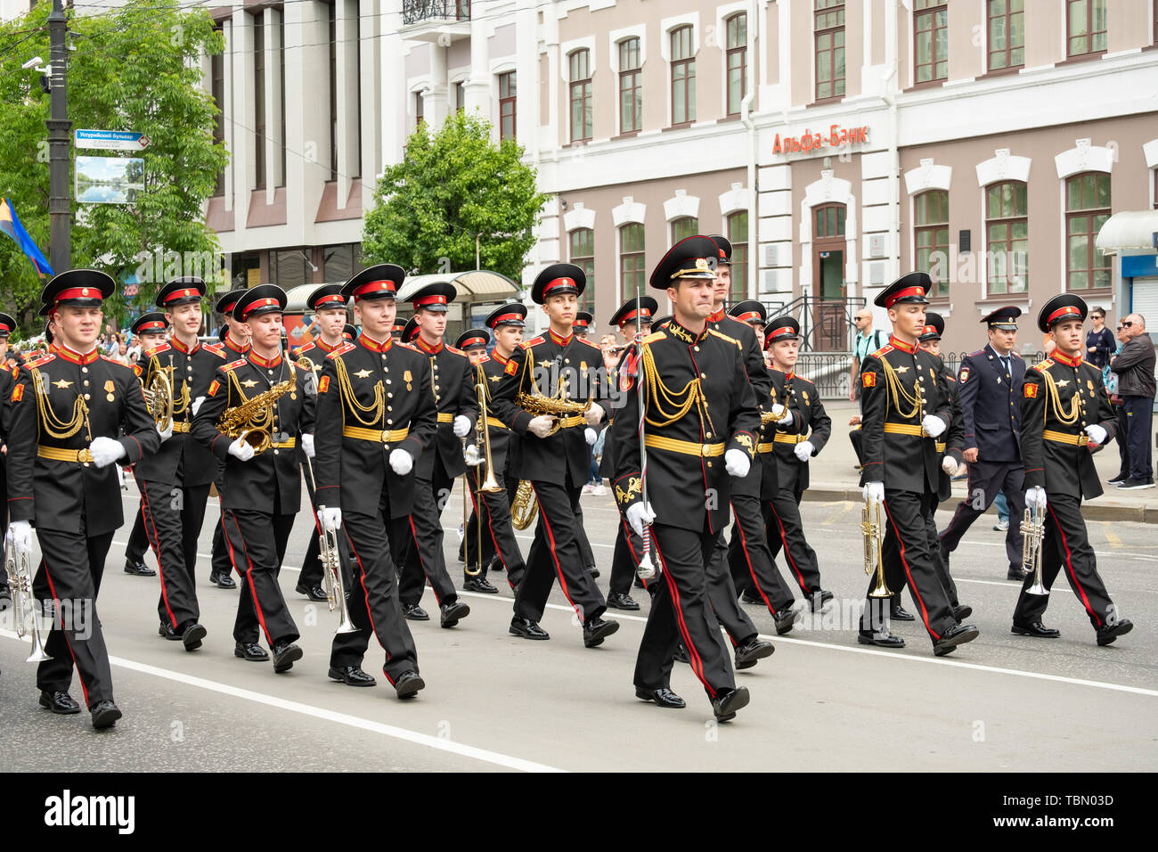 Military music bands marching through the empty streets of the city of