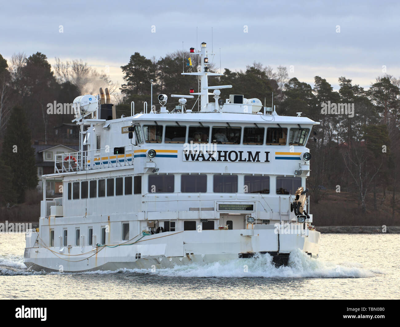Waxholm I icebreaker operated by Waxholmsbolaget arriving to Karlsudd near Vaxholm, Sweden Stock Photo