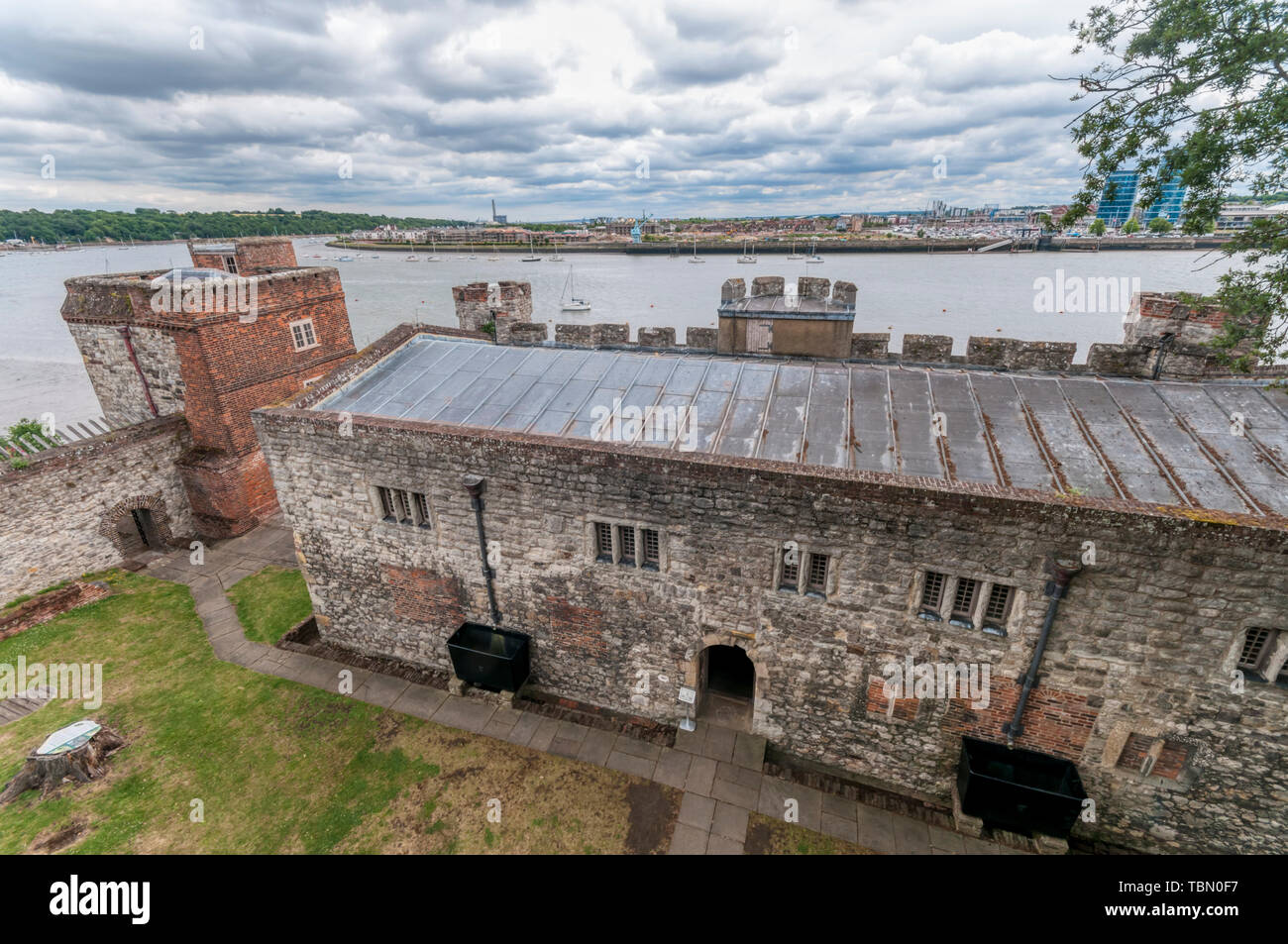 The Elizabethan Upnor Castle on the Hoo peninsula in north Kent with the River Medway and Chatham Quays in the background. Stock Photo