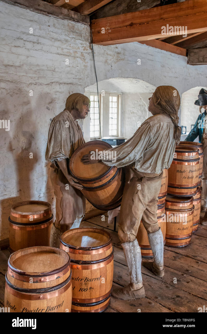 A display in the gunpowder magazine at Upnor Castle, an Elizabethan artillery fort on the Hoo Peninsula in Kent, shows handling of the powder barrels. Stock Photo