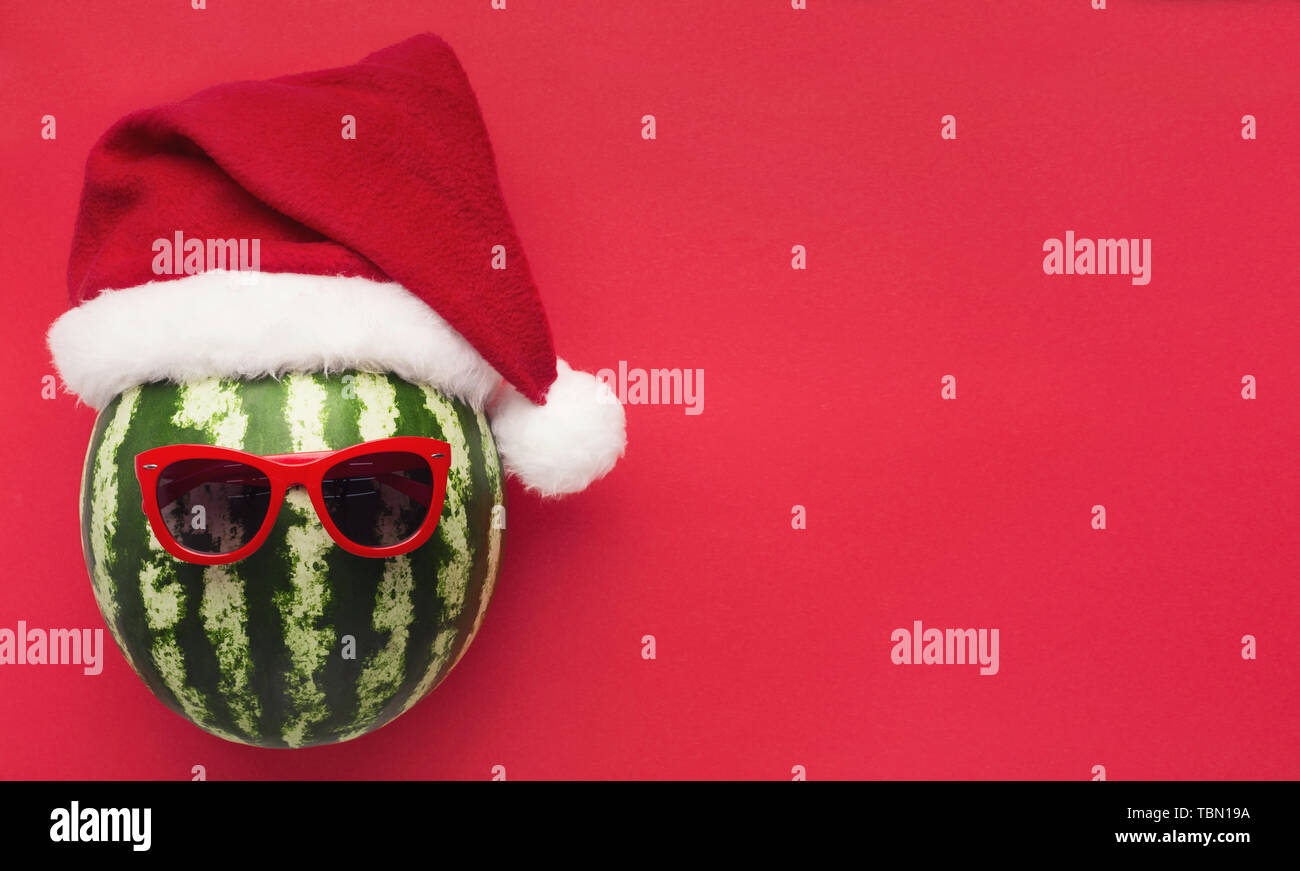 Striped watermelon in Santa hat and sunglasses Stock Photo Alamy