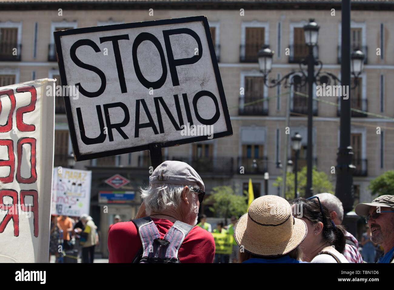 Demonstrator holds a placard during the protest. Ecologists from the Iberian Peninsula accompanied by activists from the United States, Turkey, France and Argentina, protested in Madrid for the closure of nuclear power plants, uranium mines and high-level radioactive waste management. In addition, activists have protested a new energy model to avoid cases such as Chernobyl in Ukraine and have demanded the closure of the Almaraz Nuclear Power Plant in Spain. Stock Photo