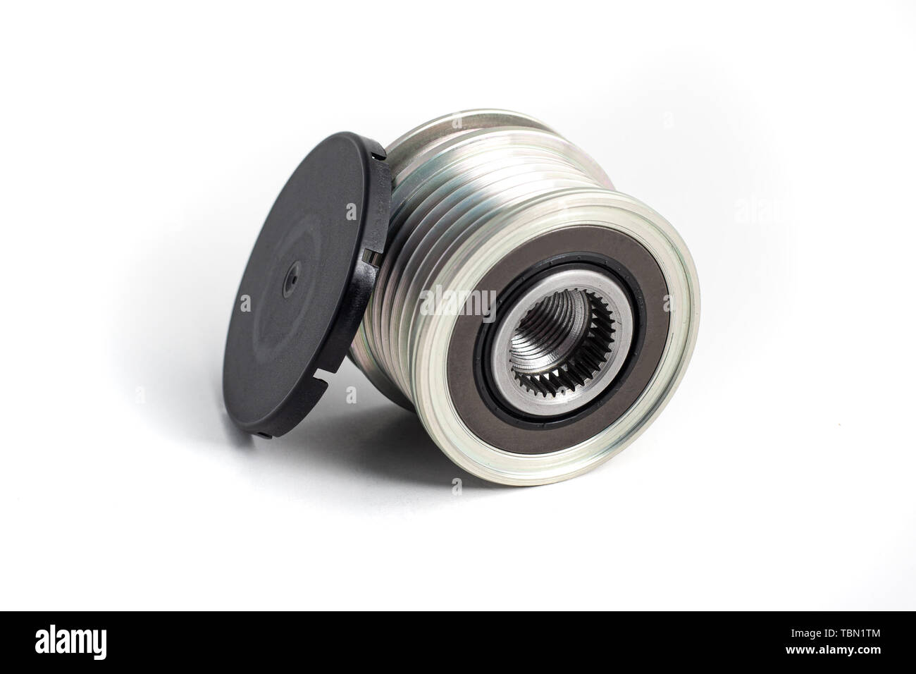 Freewheel alternator pulley on isolated white background with cap. Auto