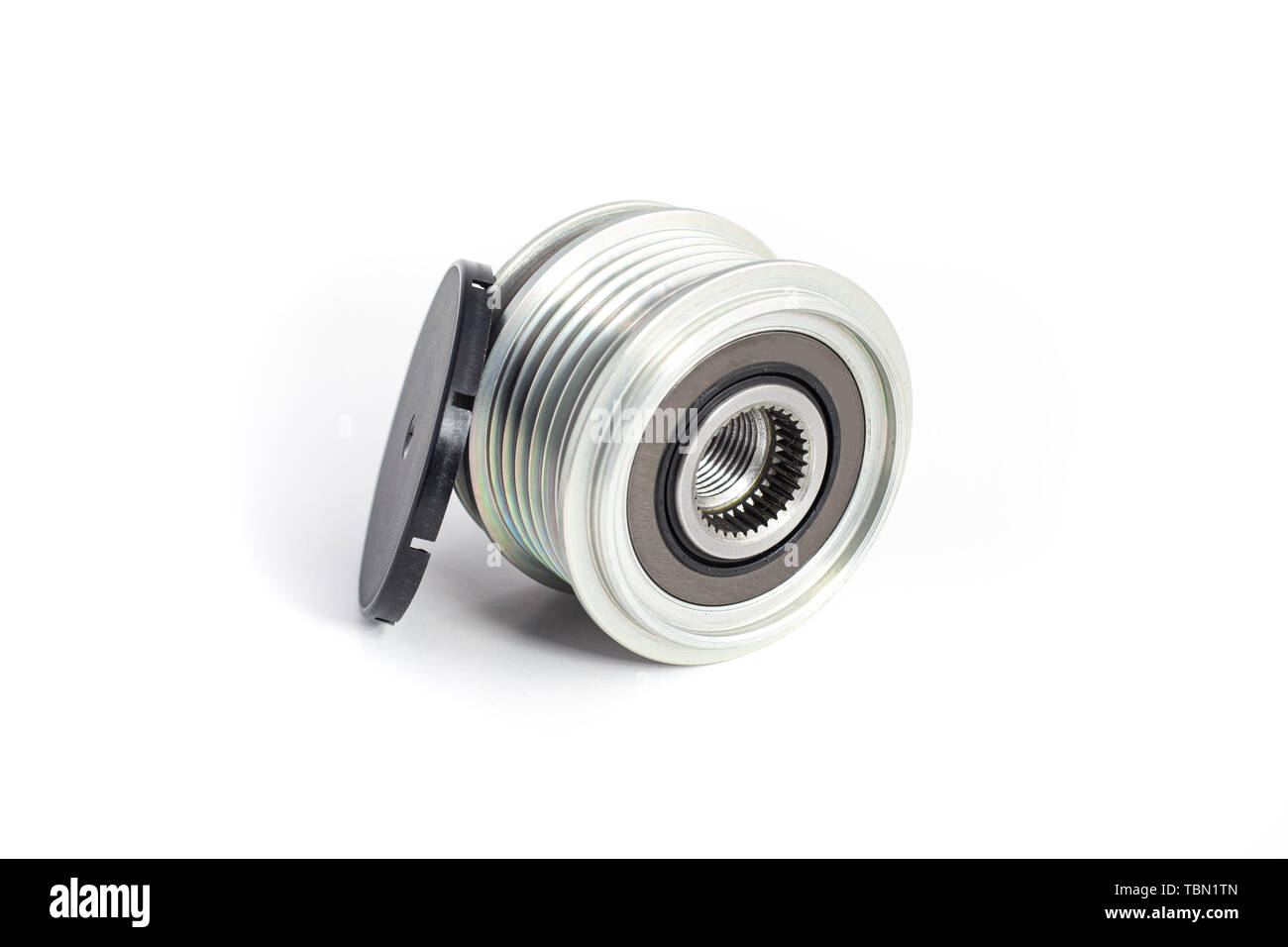 Freewheel alternator pulley on isolated white background with cap. Auto