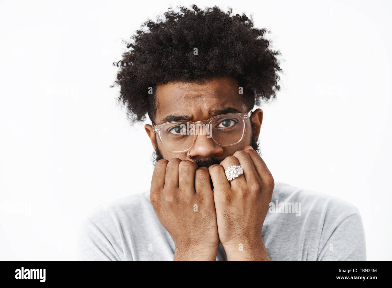 Headshot Of Anxious And Scared Masculine Timid Guy With Afro