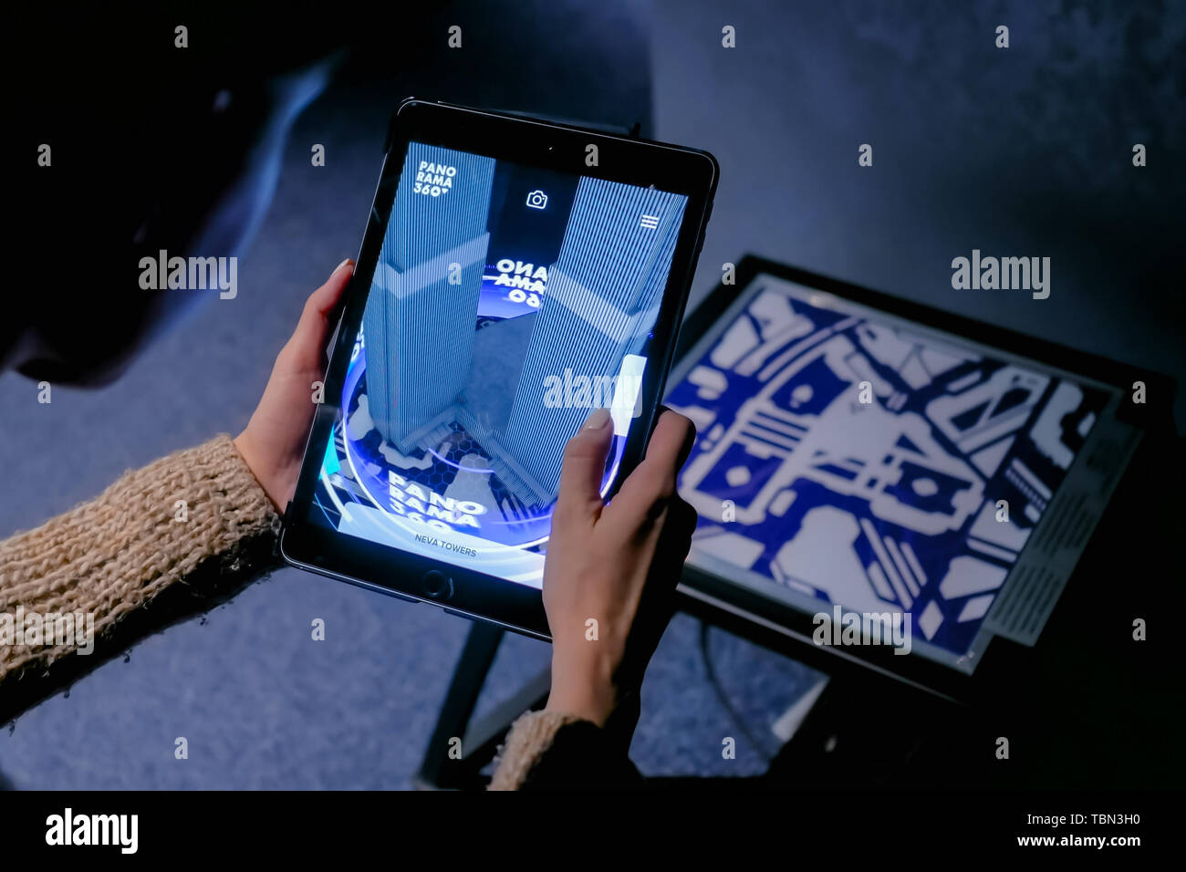 Woman using digital tablet with architecture augmented reality app Stock Photo