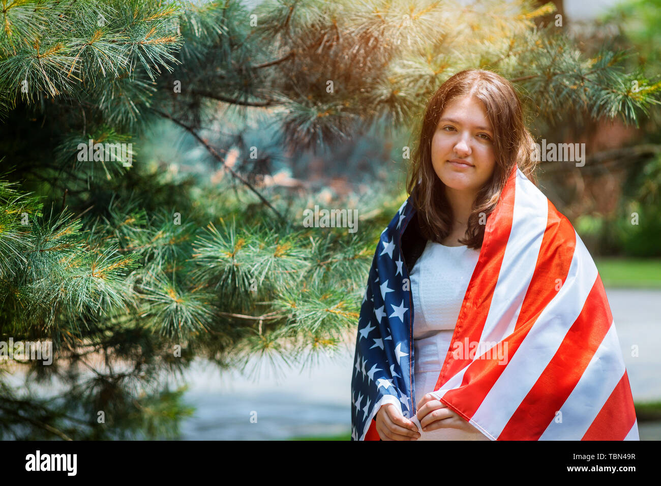 Girl holding american flag hi-res stock photography and images - Alamy