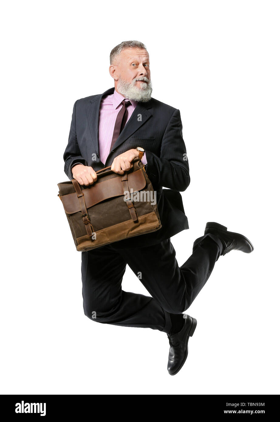 Jumping mature man with briefcase on white background Stock Photo