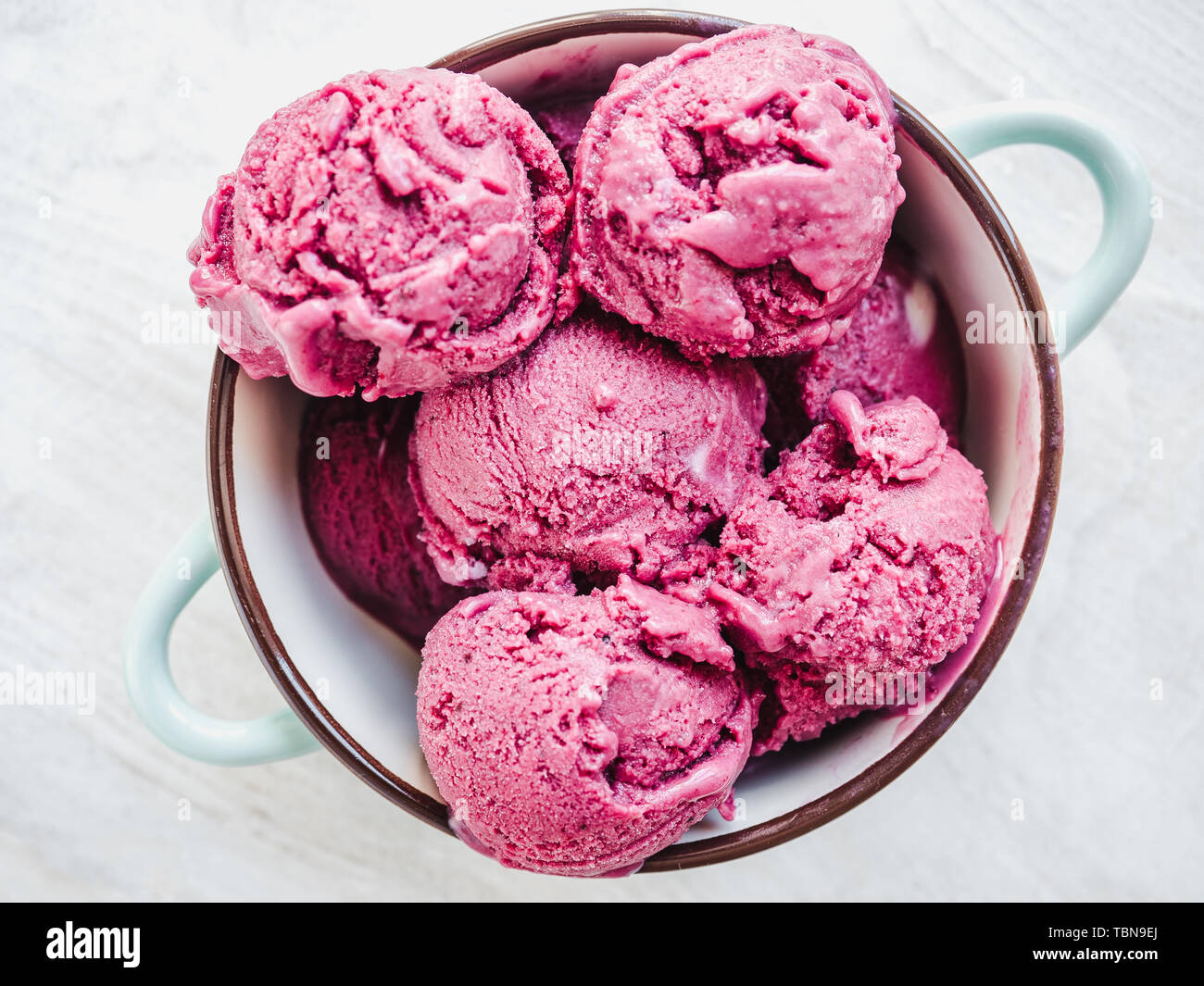 https://c8.alamy.com/comp/TBN9EJ/bright-fruit-ice-cream-on-a-vintage-plate-white-isolated-background-close-up-top-view-concept-of-tasty-and-healthy-food-TBN9EJ.jpg