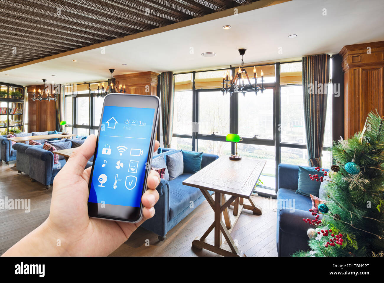 smart phone with smart home with modern cafe Stock Photo - Alamy