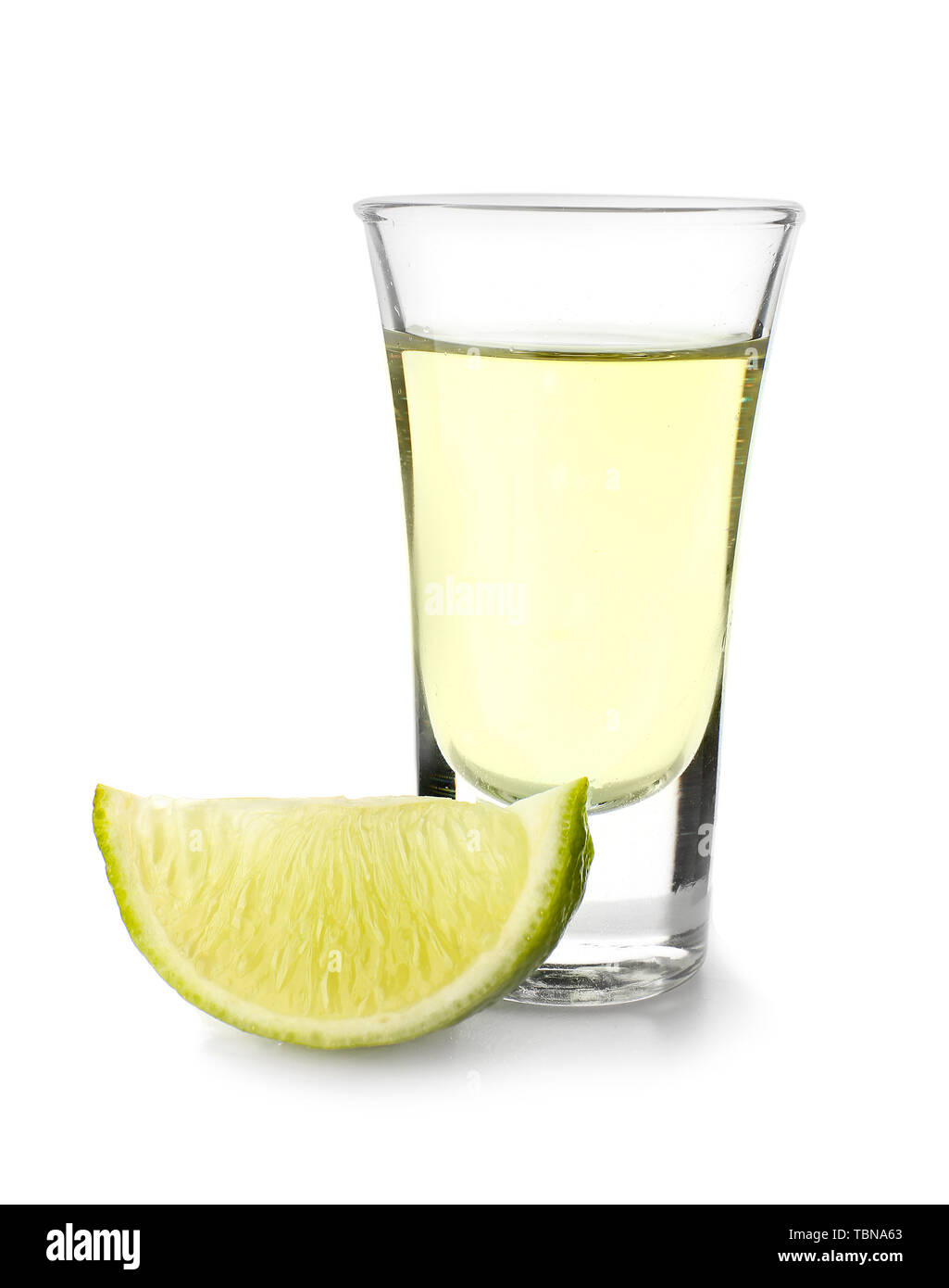 Shot of tequila on white background Stock Photo - Alamy