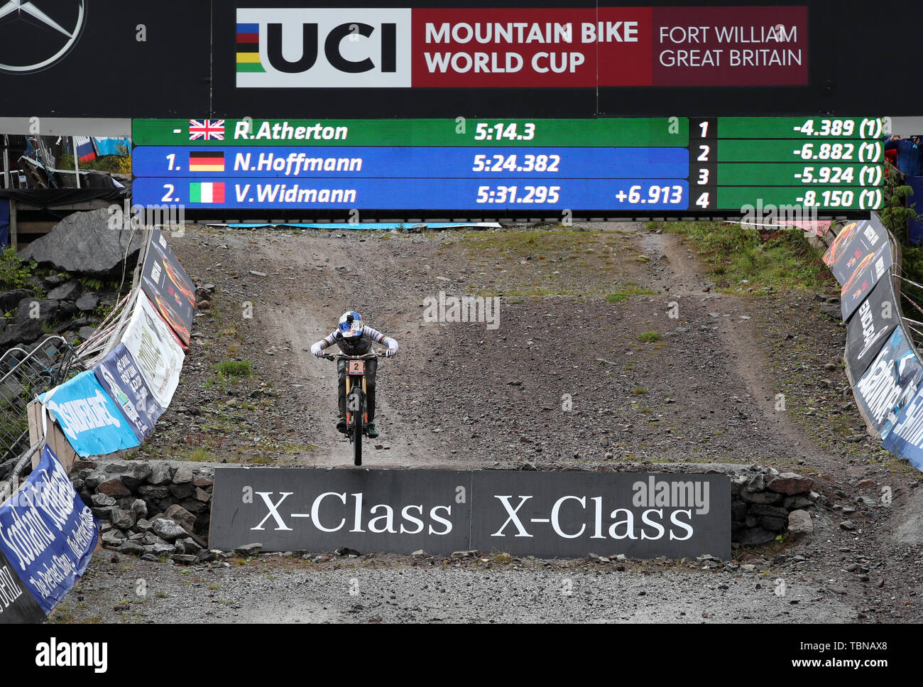 Great Britain's Rachel Atherton crosses the finish line to win the Women's Downhill during the UCI Mountain Bike World Cup at Fort William. Stock Photo