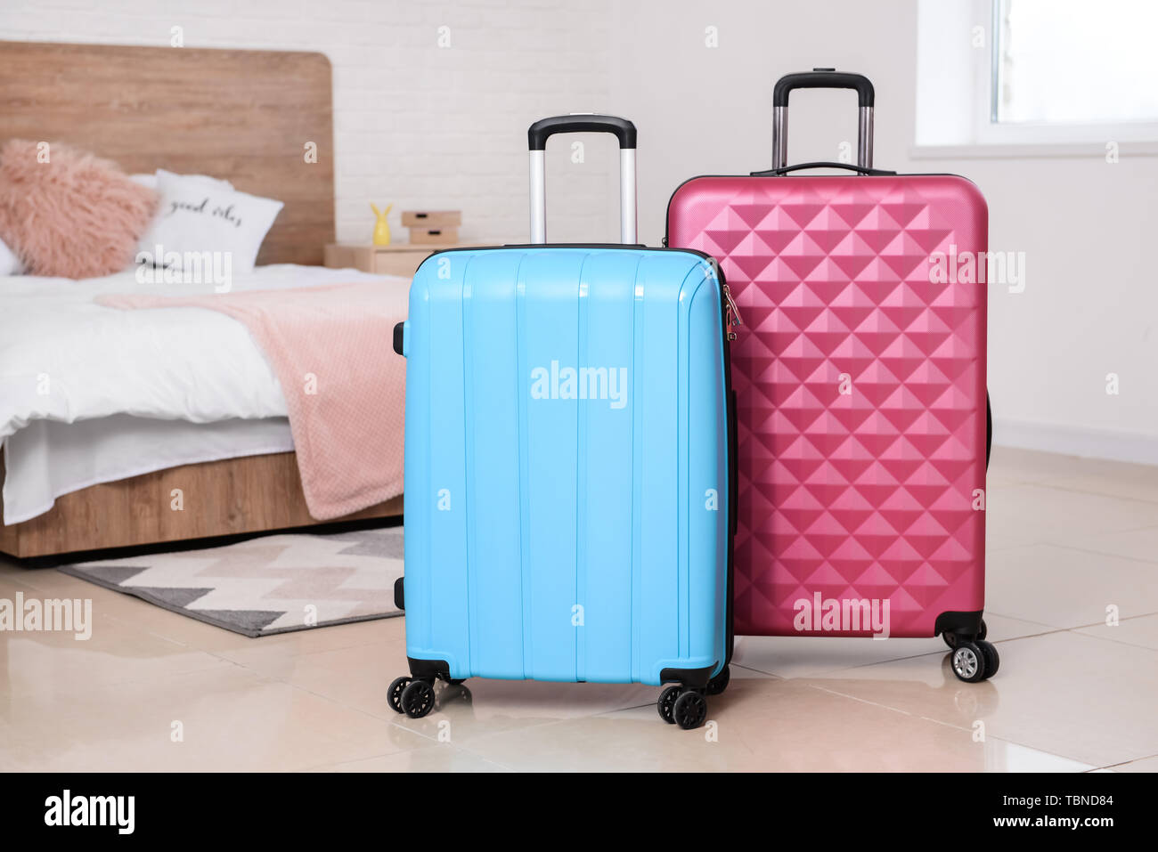 Packed suitcases in bedroom Stock Photo Alamy