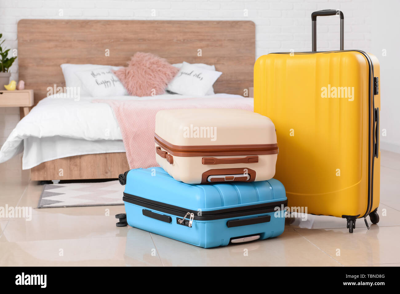 Packed suitcases in bedroom Stock Photo Alamy