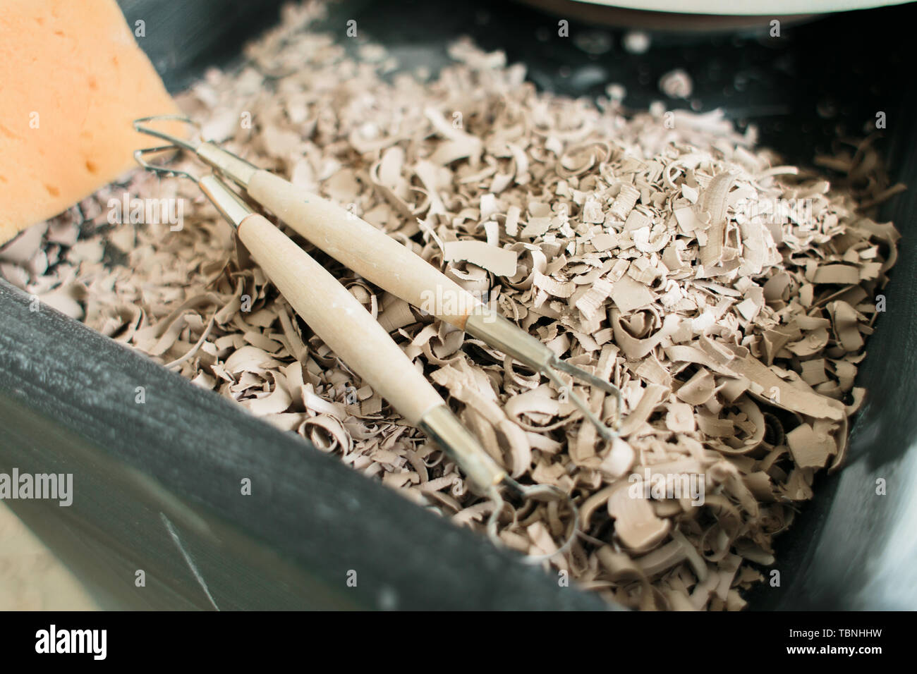 pottery tools for carving ceramic products in workshop Stock Photo
