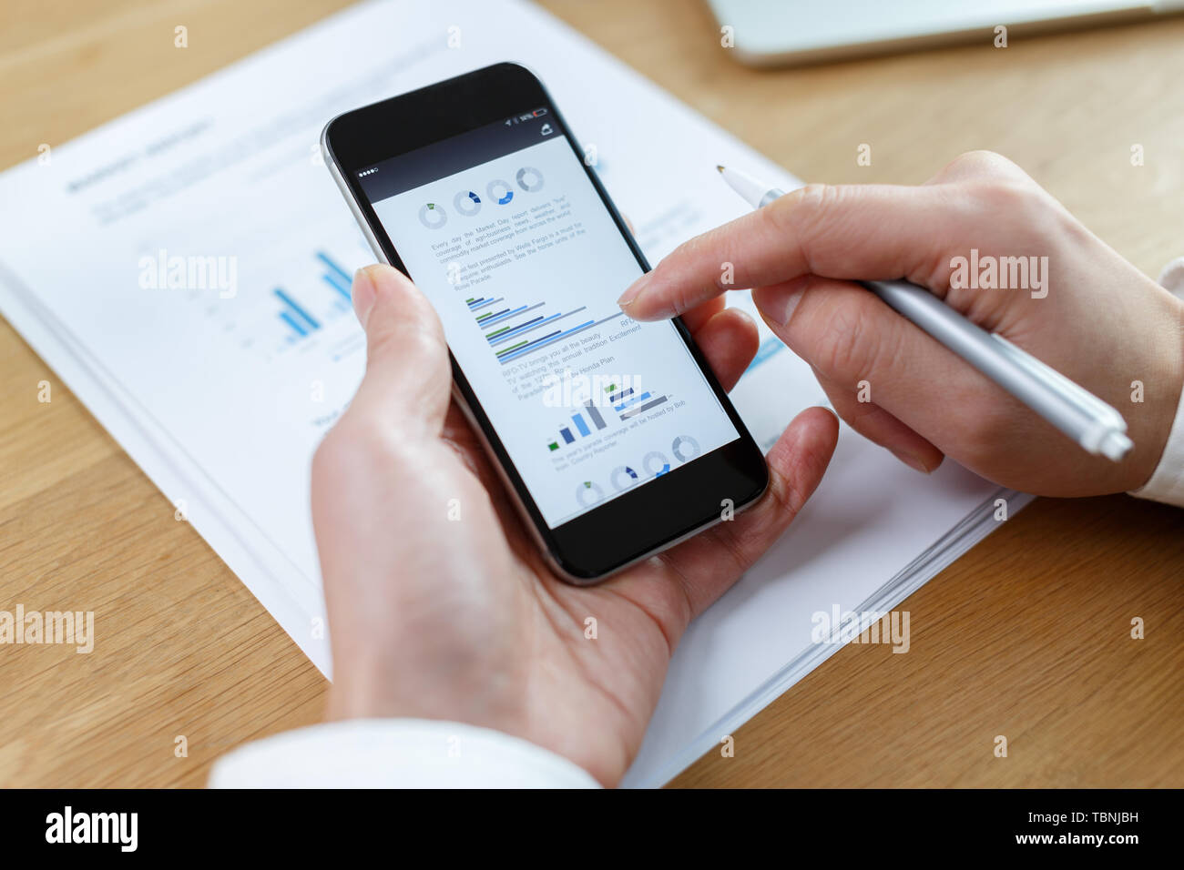 businessman checking financial reports on table Stock Photo
