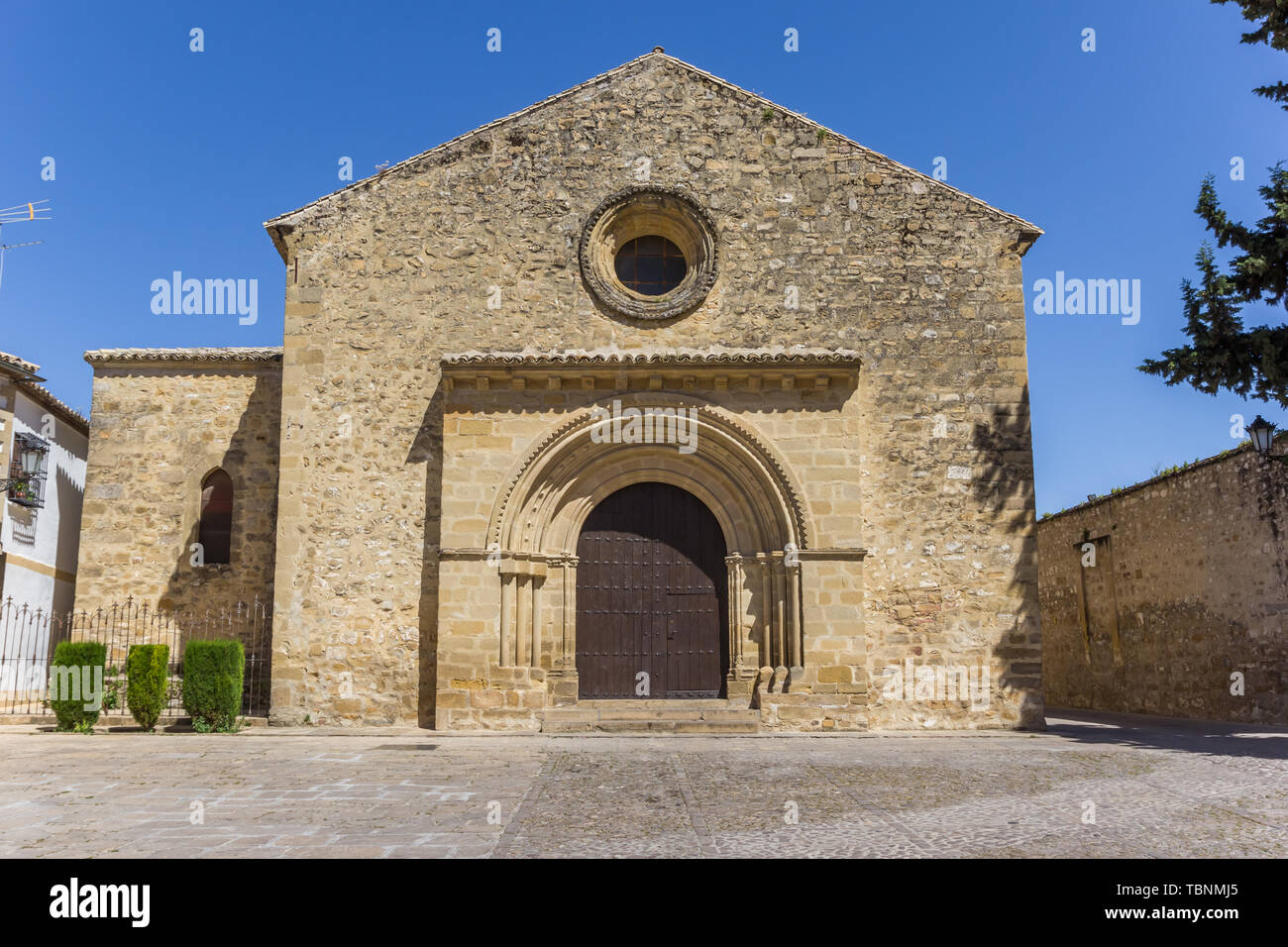 Front of the Romanica Santa Cruz church in Baeza, Spain Stock Photo