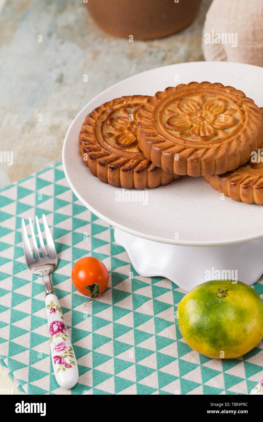 Moon cakes and fruit on the table Stock Photo