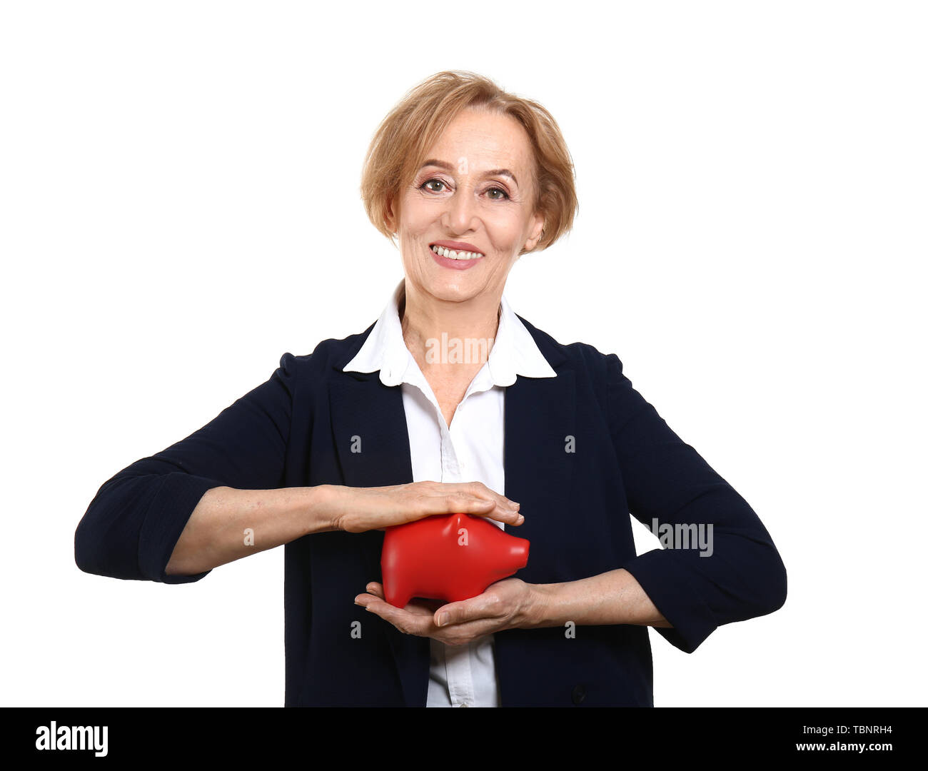 Beautiful mature woman with piggy bank on white background Stock Photo ...
