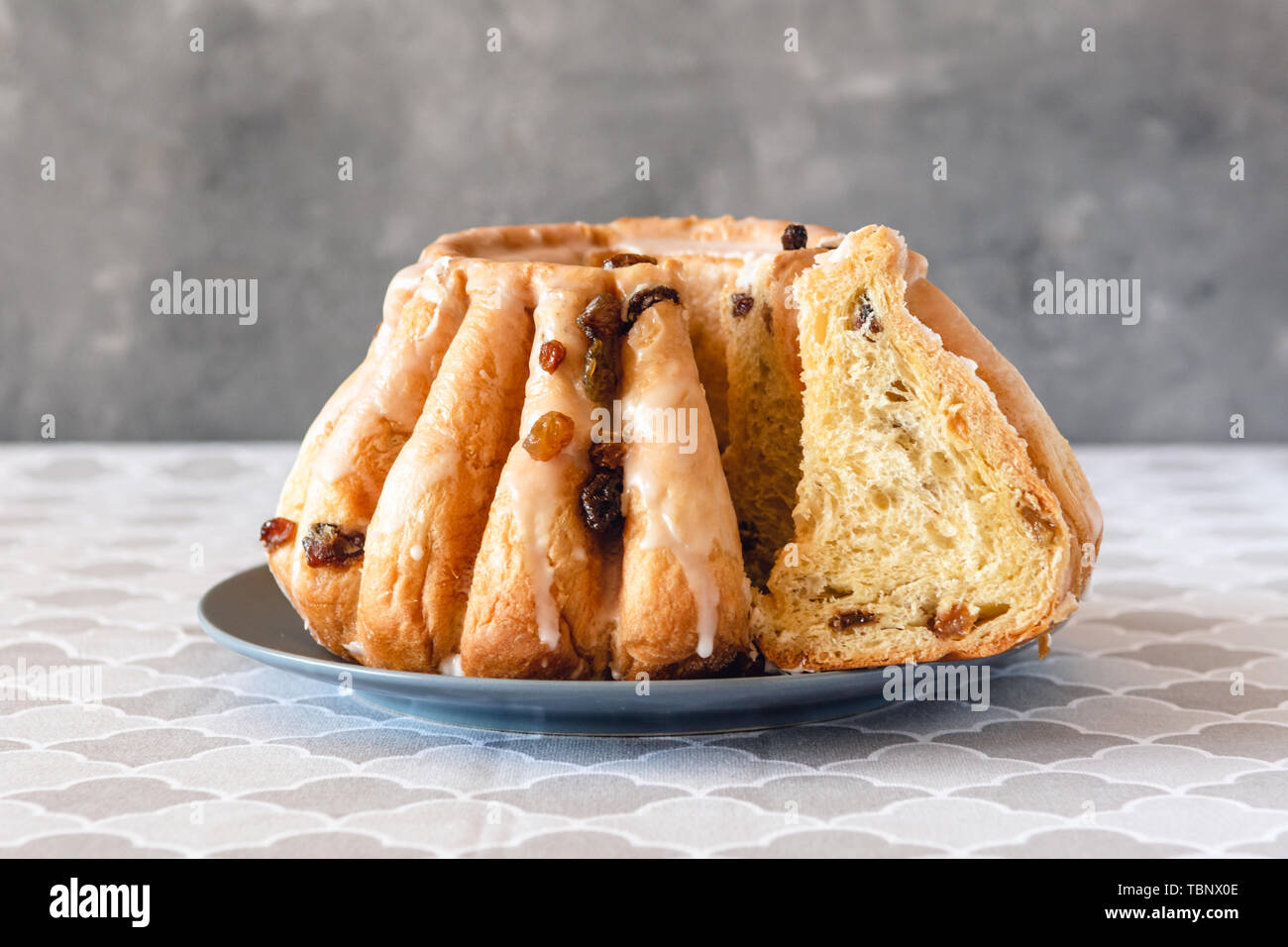 Traditional yeast ring cake with icing and raisins Stock Photo Alamy