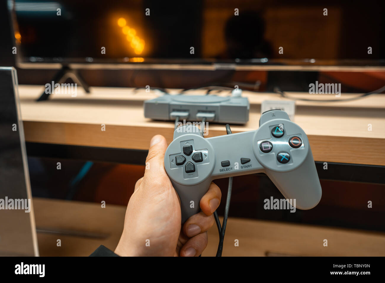 Male hands holding old a PS2 controller Stock Photo