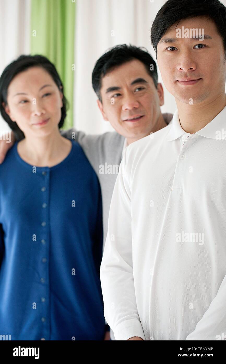 Family three standing on hi-res stock photography and images - Alamy
