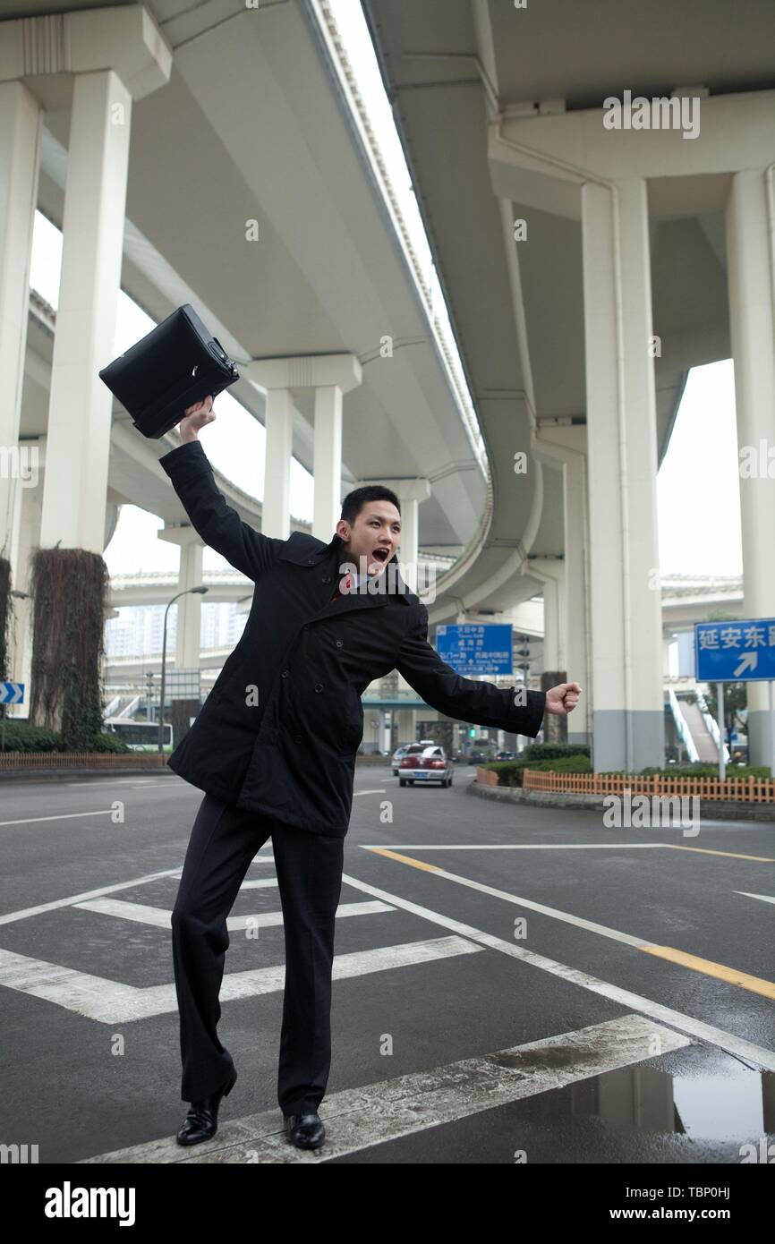 Excited man raised hands hi-res stock photography and images - Alamy