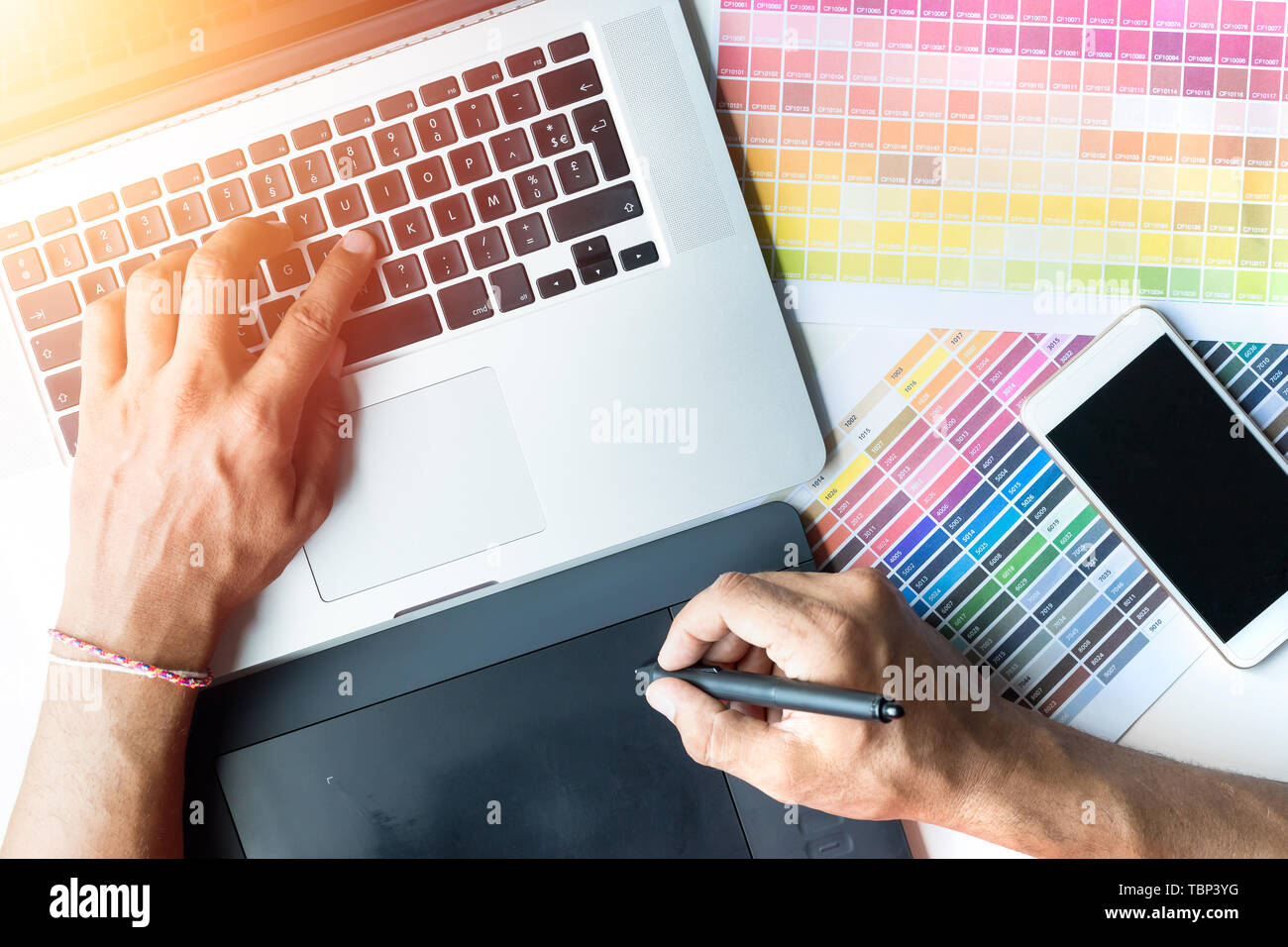 designer hand working with new modern computer laptop and pro digital ...