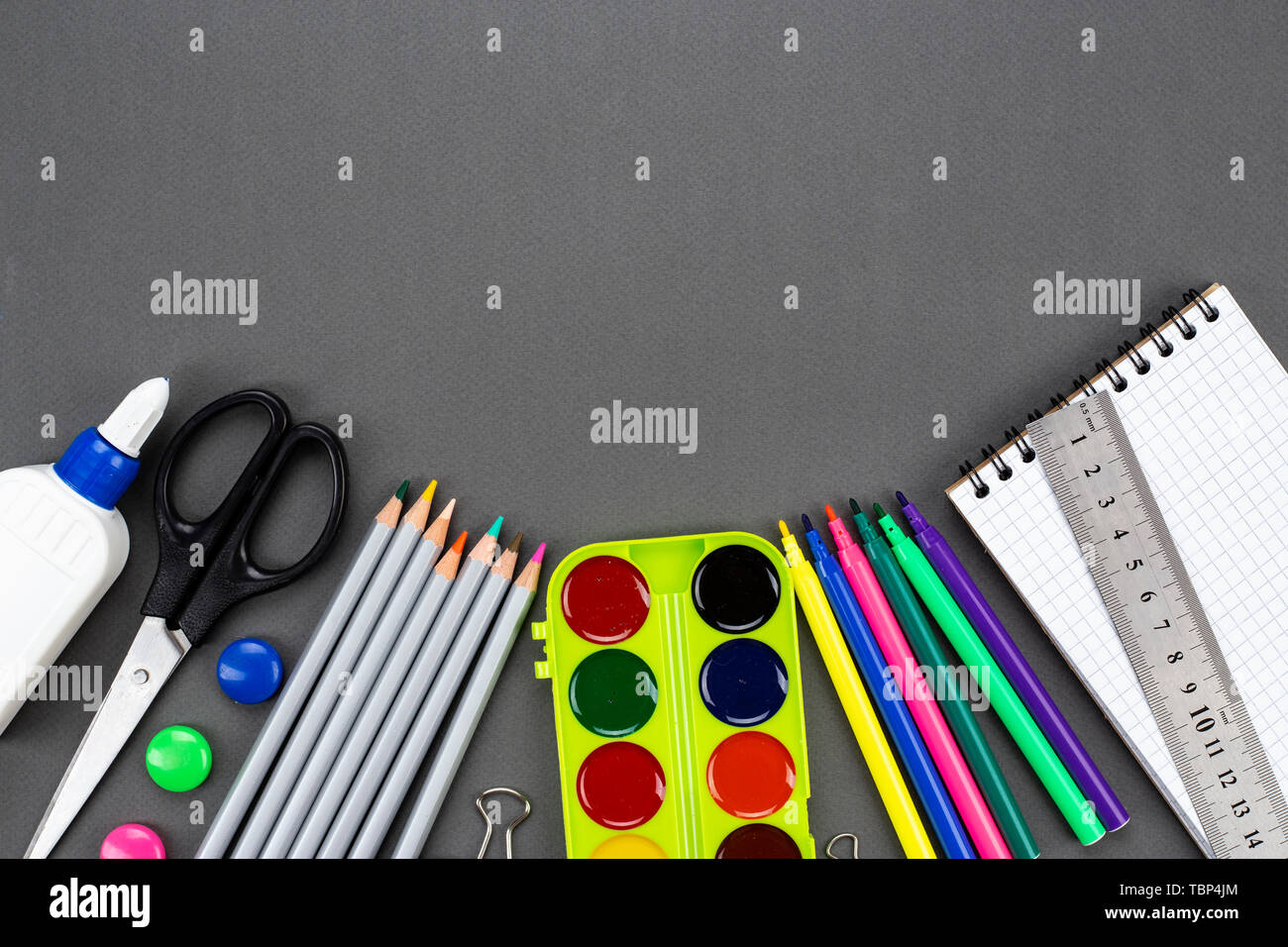 different school stationery. set on a black background. space for text Stock Photo
