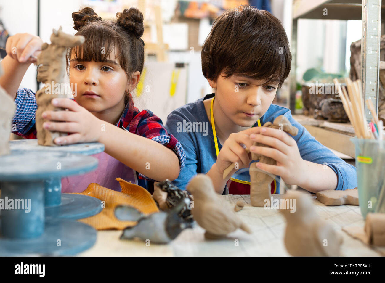 Attending art lesson. Talented creative brother and sister attending