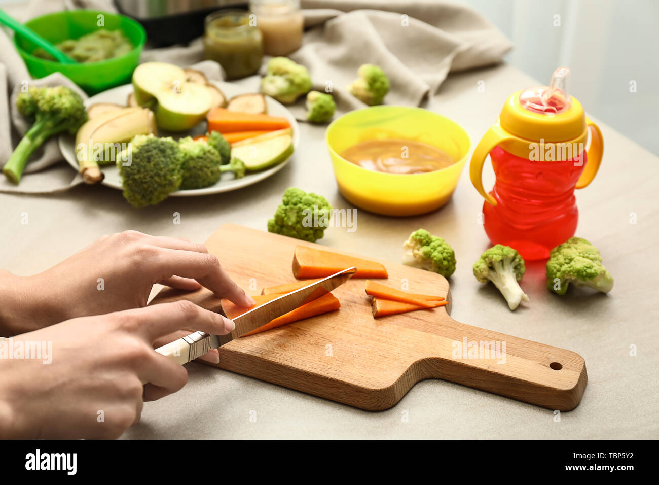Human Making Food Making fruit puree hi-res stock photography and images - Alamy