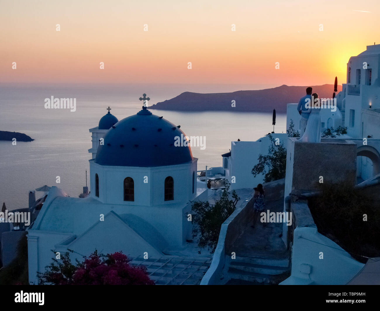 Santorini, Greece: Panorama at sunset and at night Stock Photo