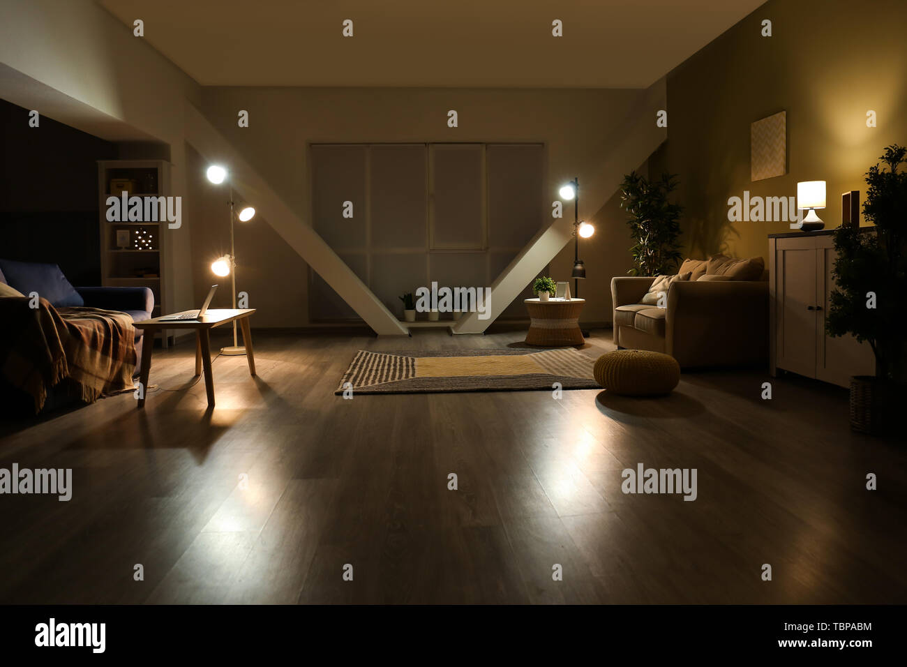 Stylish interior of living room at night Stock Photo Alamy
