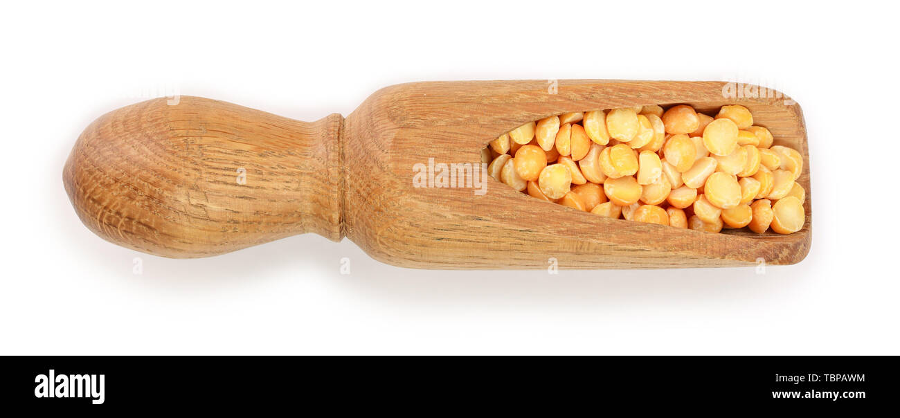 yellow split peas in a wooden scoop isolated on white background. Top view Stock Photo