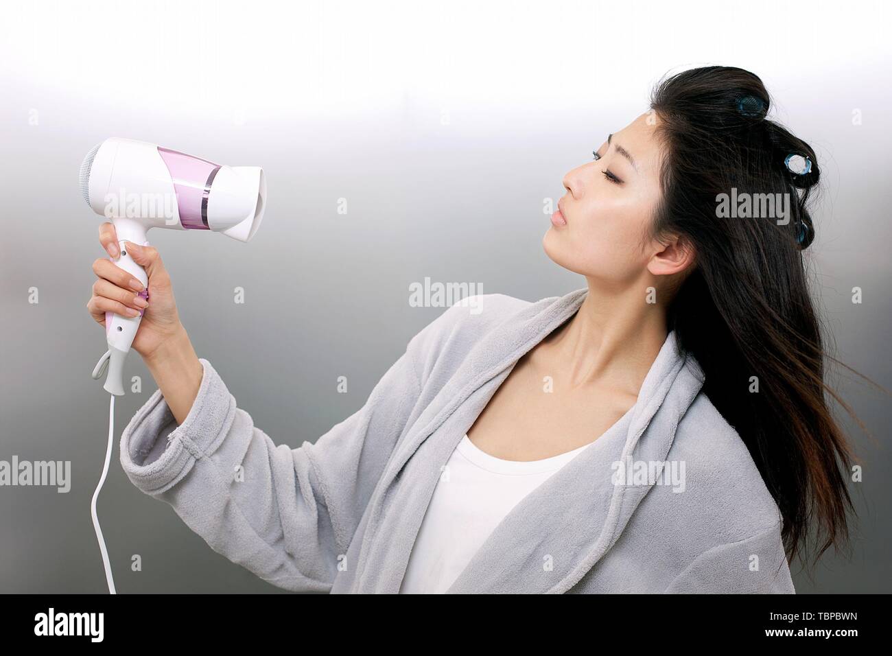 Man using hair dryer hi-res stock photography and images - Alamy
