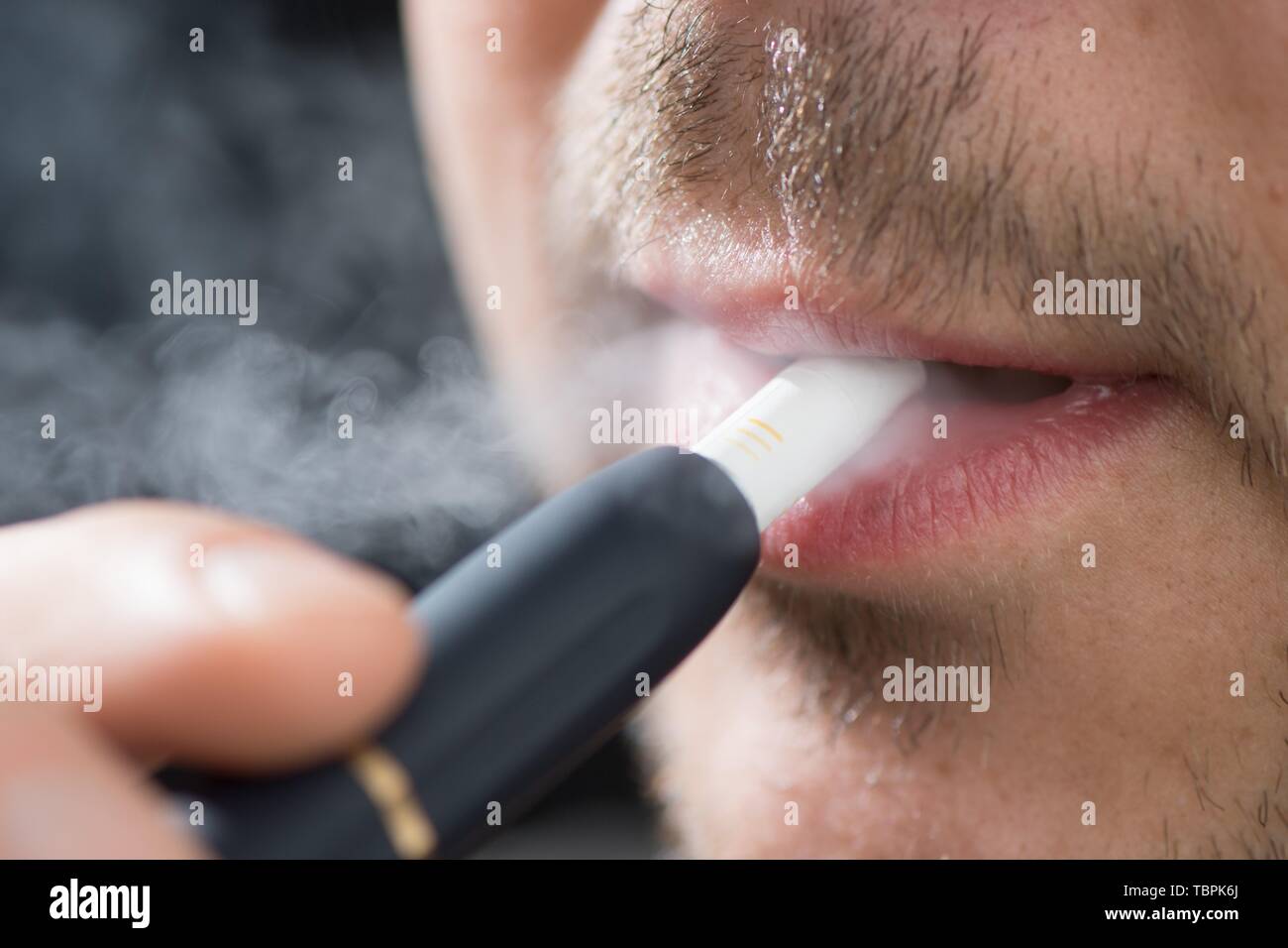 Heated cigarette hires stock photography and images Alamy