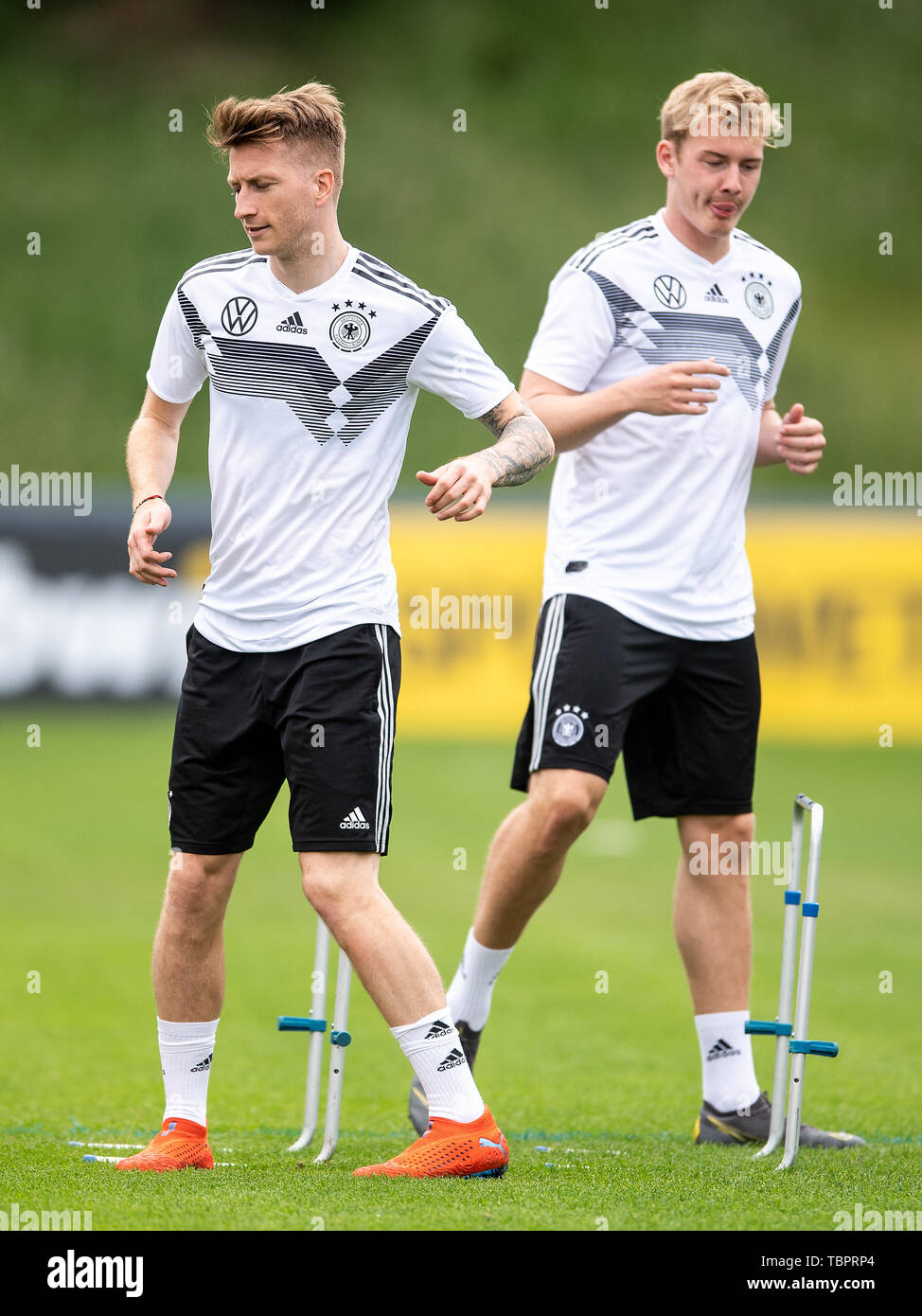 Venlo, Netherlands. 03rd June, 2019. Marco Reus (l) and Julian Brandt train with the national team in the De Koel stadium. The national football team plays against Belarus (8.6.) and Estonia (11.6.) in the European Championship qualification. Credit: Marius Becker/dpa/Alamy Live News Stock Photo