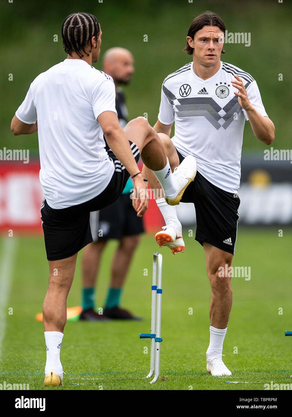 Venlo, Netherlands. 03rd June, 2019. Leroy Sané (l) and Nico Schulz train with the national team in the De Koel stadium. The national football team plays against Belarus (8.6.) and Estonia (11.6.) in the European Championship qualification. Credit: Marius Becker/dpa/Alamy Live News Stock Photo
