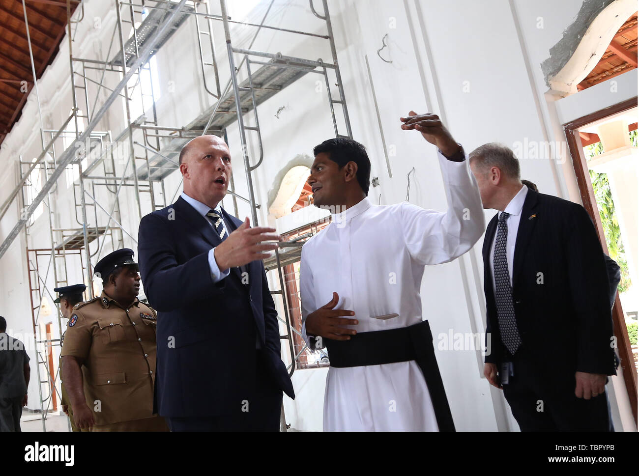 Negombo, Sri Lanka. 3rd June, 2019. Australian Minister of Home Affairs  Peter Dutton(L) and a priest Shameera Rodrigo(R) talk during his visit in  St.Sebastian's church Negombo, Sri Lanka June 3, 2019.Two Australian