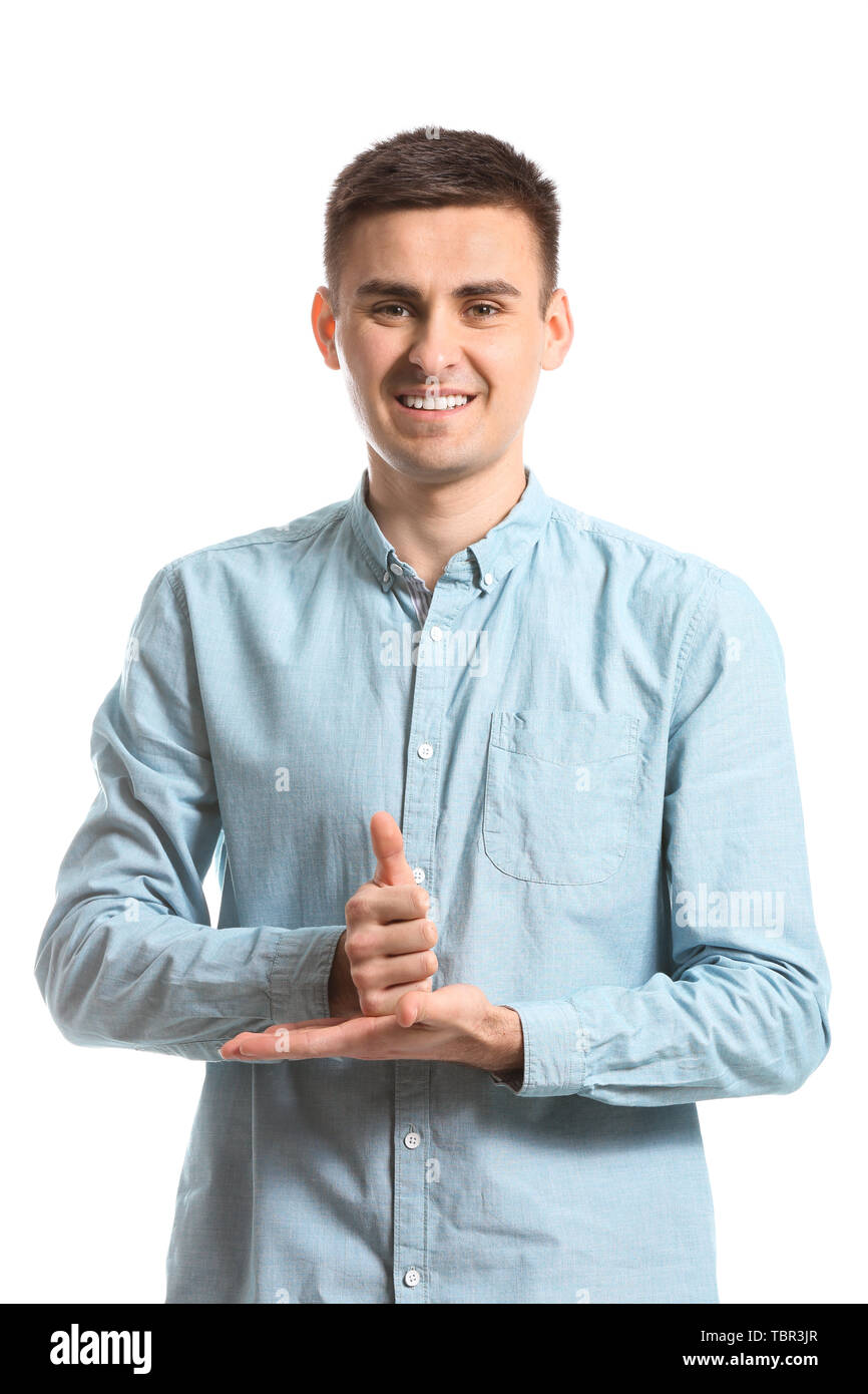 Young deaf mute man using sign language on white background Stock Photo ...