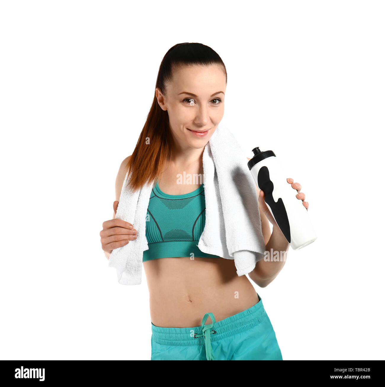 Sporty woman with towel and bottle of water on white background Stock ...